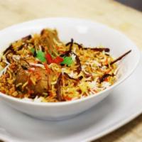 Hyderabad Chicken Biryani · Aromatic basmati rice cooked with special herbs and spices. Served with yogurt raita and daal.