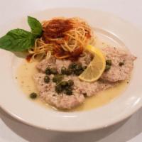 Veal Piccata · Sauteed veal Scaloppini with capers in a white wine lemon butter sauce.