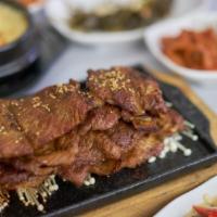 Grilled Short Ribs · Served with steamed rice, miso soup, and sides (banchan).