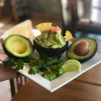 Guacamole and Chips  · Mashed ripe avocados with onions, cilantro and lime juice. 
