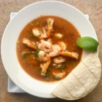 Sopa de Mariscos · A combination of seafood (clams, shrimp, calamari, crab, mussels) and vegetables in a red se...