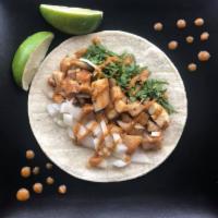 Tacos de Pollo · Chicken. Made with soft corn tortillas and topped with chopped onions, cilantro and salsa pi...
