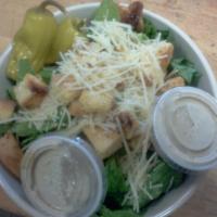 Caesar Salad · Romaine, pepperoncini, shredded Parmesan and croutons. Add anchovies for an additional charge.
