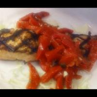 Grilled Salmon · With roasted peppers and side of pasta. Includes tossed salad and bread.