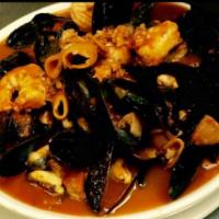 Cioppino · Mussels, shrimp, calamari and clams served red over pasta.