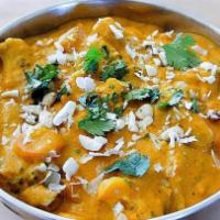 32. Navrattan Korma · A melange of vegetables in cashew, almond and creamy sauce.