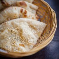 49. Butter Naan · Soft flour bread with butter and sesame seeds (clay oven).