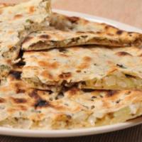 50. Onion Kulcha · Naan stuffed with onions and cilantro (clay oven).