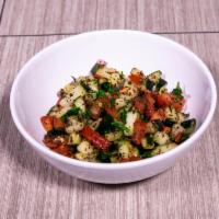 Fattoush Salad · Diced cucumber, tomato, bell peppers, chopped green onions, carrots, radish, fresh mint leav...