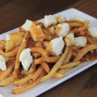 Canadian Poutine Spud Topper · Fries covered with homestyle gravy and cheese curds.