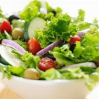 Green Salad · Fresh salad with a variety of green vegetables typically served on a bed of lettuce.