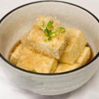 Age Tofu · Deep fried bean curd, served with grated ginger and scallion in sauce.
