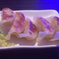 Shrimp Gyoza · Pan fried shrimp and vegetable dumplings.