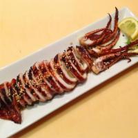 Grilled Whole Squid · Grilled whole squid with chef sauce.