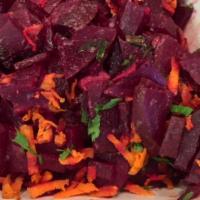 Fresh Beet Salad · Lightly pickled beets mixed with cinnamon apples and shredded carrots in a light balsamic vi...