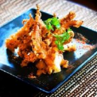 Geso Karaage · Traditional deep-fried squid tentacles with Japanese citrus and chili pepper.