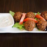Falafel · 5 pieces. Combination of chickpeas, jalapeño, fresh parsley and spice.