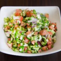 Shirazi Salad · Fresh cucumber, tomato, parsley, red onions, and dressing.