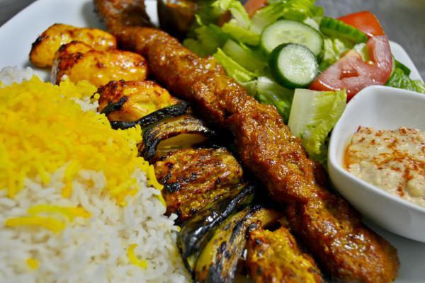 Kebab Combination · Grilled ground beef or chicken, shish kebab, and boneless chicken. Served with 2 skewers, 3 different type of meat. Also served with rice, garden salad, hummus, and pita.