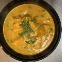 Muttar Paneer · Fresh cottage cheese cubes prepared with green peas in onions based curry sauce. Vegetarian.