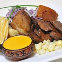 PARA PICAR · Combination platter of anticuchos, tamale, yuquitas a la huancaina, and sliced corn on the cob