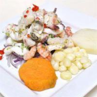 CEVICHE MIXTO · Raw fish and seafood marinated in lime juice with garlic, celery, onions and rocoto chili, s...