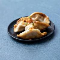Sichuan Steamed Spicy Dumplings · 6 pieces with peanuts.