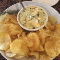 Spinach and Artichoke Dip · Baby spinach and chopped artichokes simmered with garlic, herbs and 5 creamy cheeses. Hand-c...