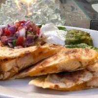 Grilled Chicken Quesadilla · Jack and cheddar cheeses, pico de gallo, guacamole and sour cream.