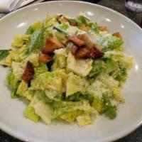 Grilled Chicken Caesar Salad · Chopped romaine tossed with Parmesan, grilled chicken breast, garlic croutons and creamy Par...
