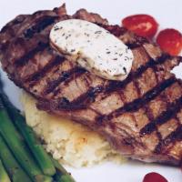 Angus New York Strip · 10 oz. Angus New York strip grilled to your liking and served with asparagus, roasted garlic...