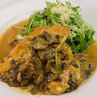 Chicken Marsala · Tender chicken breast filets and cremini mushrooms sauteed in Marsala wine. Served with spag...