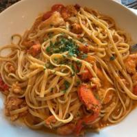 Lobster and Shrimp Linguine · Tender Maine lobster and jumbo shrimp with baby tomatoes, lemon essence and brandy-roasted l...