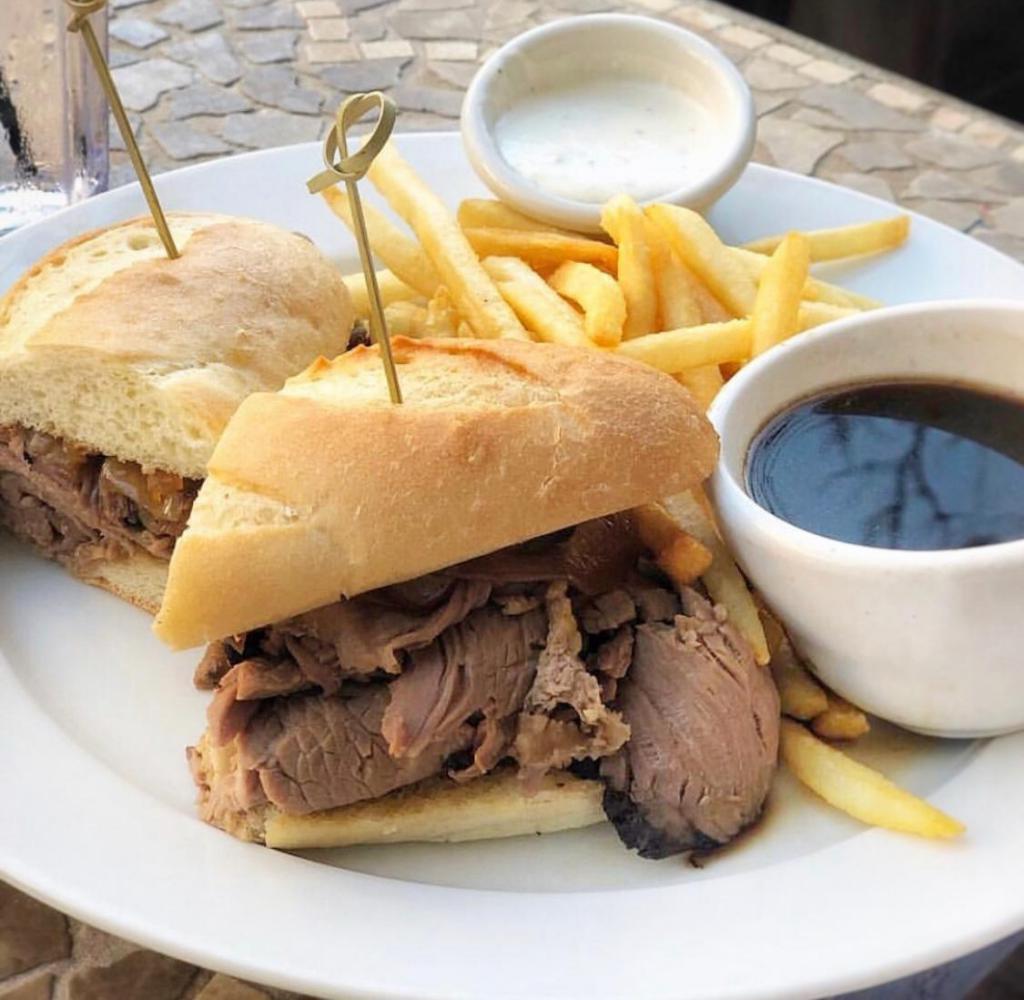 8 oz. Prime Rib French Dip · Thinly sliced roast prime rib warmed in rich beef jus and piled high in a crusty French roll with grilled onions, atomic horseradish cream and au jus.