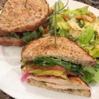 Buttermilk Grilled Chicken Sandwich · Crispy bacon, heirloom tomato, arugula, green goddess dressing, avocado and pickled red onio...