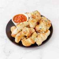Garlic Knots with Sauce · 12 pieces. Rolled baked garlic bread with sauce. 