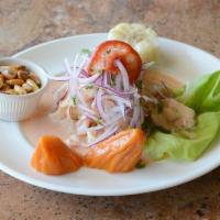 Ceviche de Pescado · Marinated fresh fish in fresh lime juice, mixed with onions, cilantro and a touch of rocoto ...