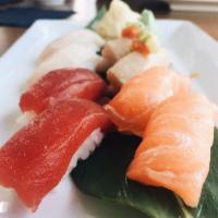 75). Sushi Sampler · 2 salmon, 2 yellowtail, 2 tuna, 2 albacore.