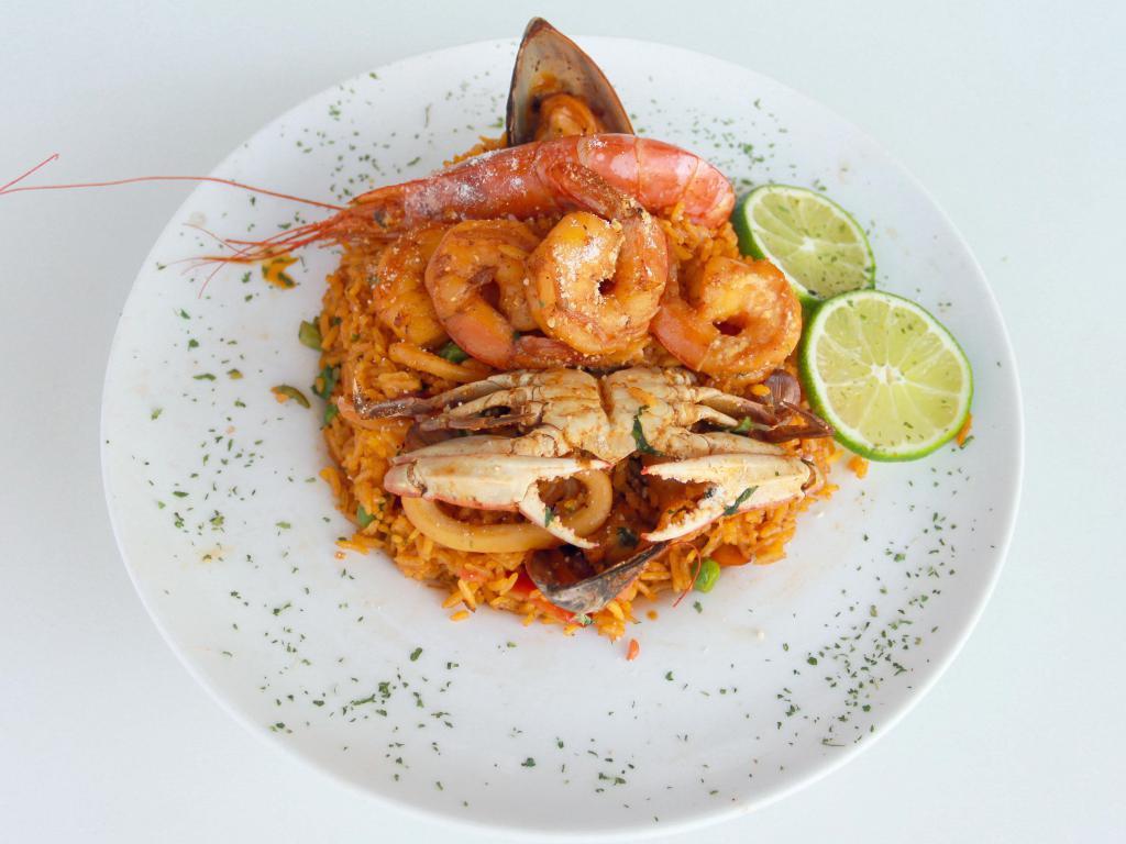 Arroz con Mariscos · Assorted fresh mixed seafood and yellow rice, sauteed with onions and garlic. 