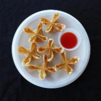 Cheese Puffs · 6 pieces. Cream cheese blended with imitation crab meat in a crispy wonton wrapper, served w...