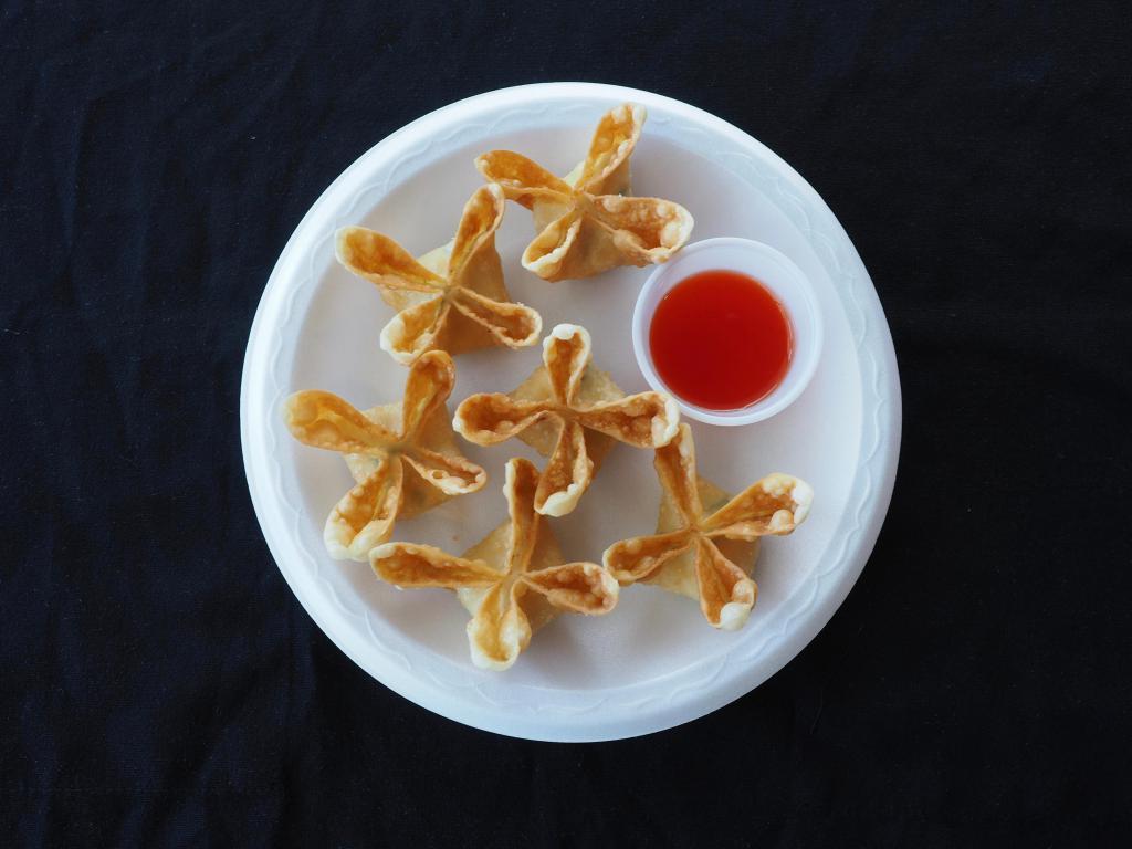 Cheese Puffs · 6 pieces. Cream cheese blended with imitation crab meat in a crispy wonton wrapper, served with sweet & sour sauce.