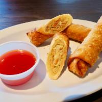Chicken Egg Rolls · 3 pieces. Chicken and vegetables in a crispy wonton wrapper, served with sweet & sour sauce.