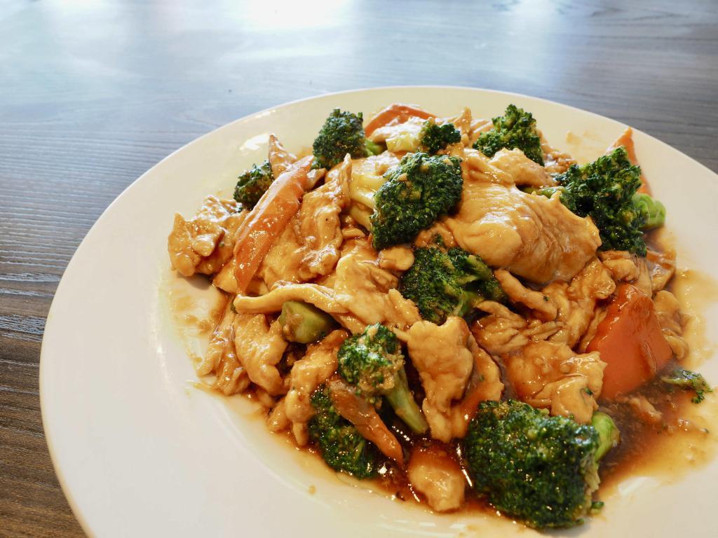 Broccoli Chicken · Broccoli and carrots cooked in our garlic, ginger based brown sauce.