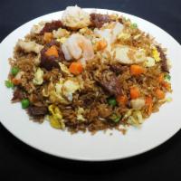 House Fried Rice · Tender chicken, flank steak beef, jumbo shrimp, eggs, peas, and carrots with soy sauce based...