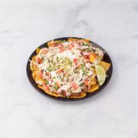 Nachos · Served with your choice of meat, lettuce, guacamole, sour cream, cheese, beans and pico de g...