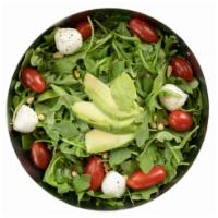 Arugula Salad · Fresh arugula, cherry tomatoes, pine nuts and fresh mozzarella, topped with avocado and serv...