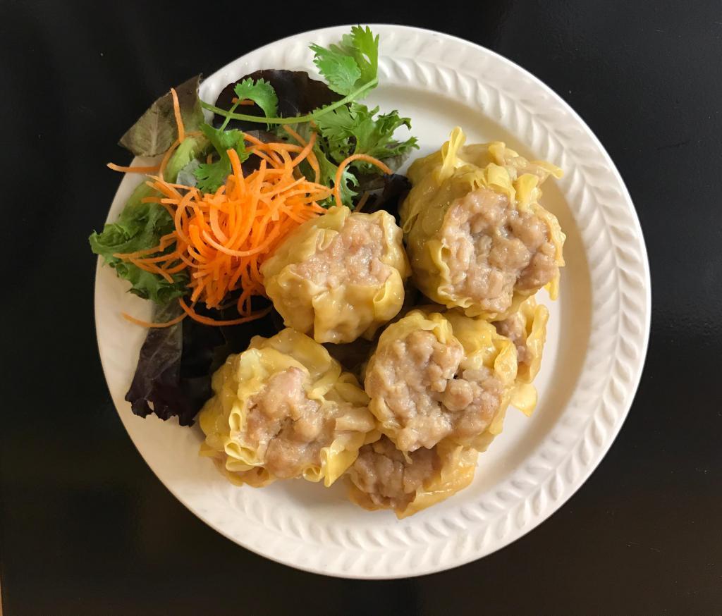 Dumpling · Steamed minced chicken and shrimp dumpling, served with Thai soy sauce.