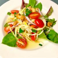 Mango Salad · Shredded mangoes, cashew nuts, red onions and tomatoes in chili lime dressing. Hot and spicy.