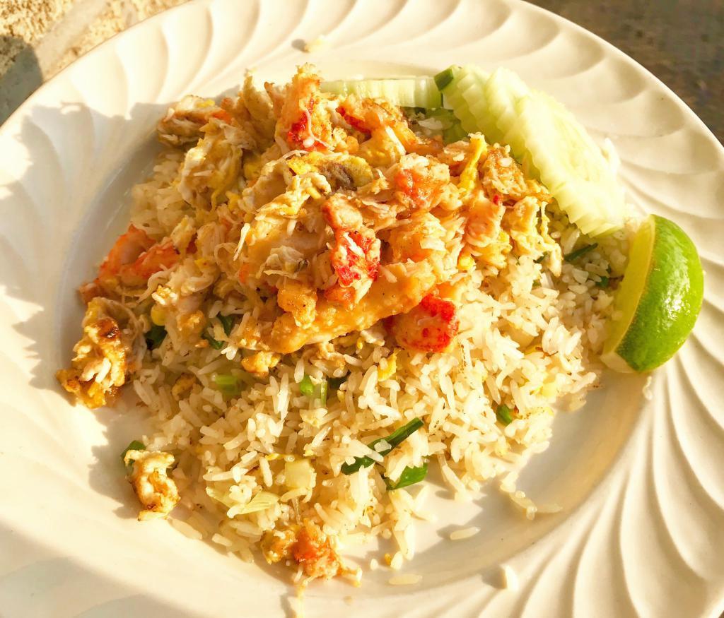 Crab Meat Fried Rice · Jasmine rice with crab meat, onions, scallions, tomatoes and eggs.