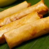 Banana Fritters · Fried banana in crispy pastry served with honey